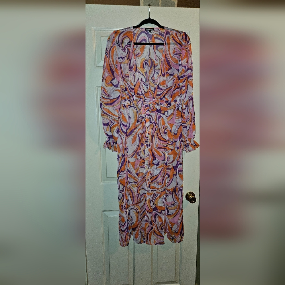 Express wrap or bathing suit cover up. Gorgeous pink and purple colors
